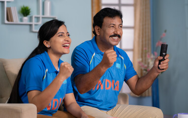 focus on father, Excited joyful father with daughter celebrating India's win while watching Cricket...