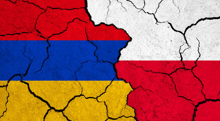 Flags of Armenia and Poland on cracked surface - politics, relationship concept