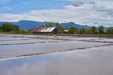 Salt pans and storage house in Kampot, Cambodia