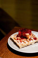 Belgian waffles with cheesecake and berries. Breakfast in cafe
