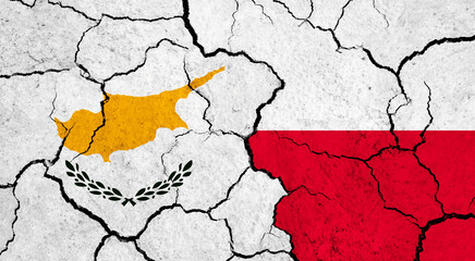 Flags of Cyprus and Poland on cracked surface - politics, relationship concept