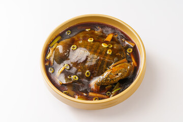 Braised soft-shelled turtle with scallions on pure white background