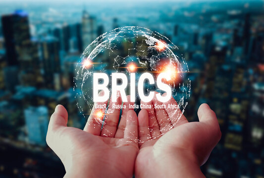 two hands embracing globe icon New currency concept of 'BRICS', cooperation of 5 superpowers begins Enter into a cooperation agreement on the use of a new currency for international trade.