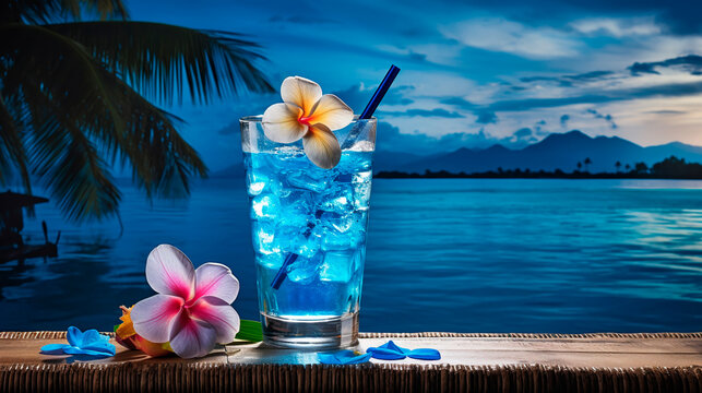 Fototapeta Summer holiday concept. Blue hawaii soda cocktail on blur tropical beach and blue sky background.