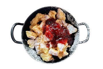 Typical Bavarian dessert kaiserschmarrn on a white isolated background, top view.