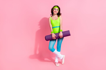 Photo of sportive yoga lady hold fitness carpet for comfort practice isolated on pastel color background