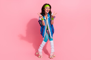 Photo of sportive lady coach roller skates rider in rink street make v sign isolated on pastel...