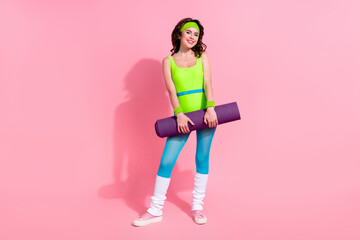 Photo of sportive lady hold fitness mat record video for daily sport blog yoga activity practice isolated on pastel color background
