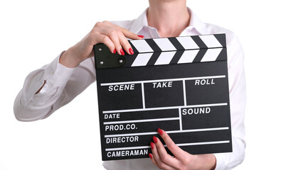 Woman pinches black clapboard and give signal for filming. Shooting series