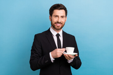 Photo of cool handsome boss guy dressed black suit having break drinking tea isolated blue color background