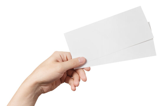 Male hand holding two blank sheets of paper (tickets, flyers, invitations, coupons, banknotes, etc.), cut out