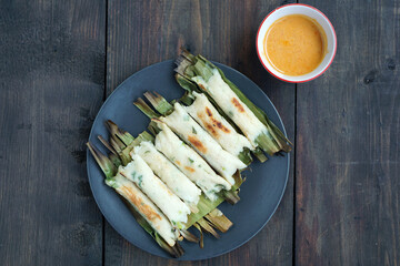 Otak-Otak is an Indonesian snack. The main ingredient of the dish is ground fish paste. Otak-otak is traditionally served steamed or grilled, encased within the leaf parcel it is cooked in.           