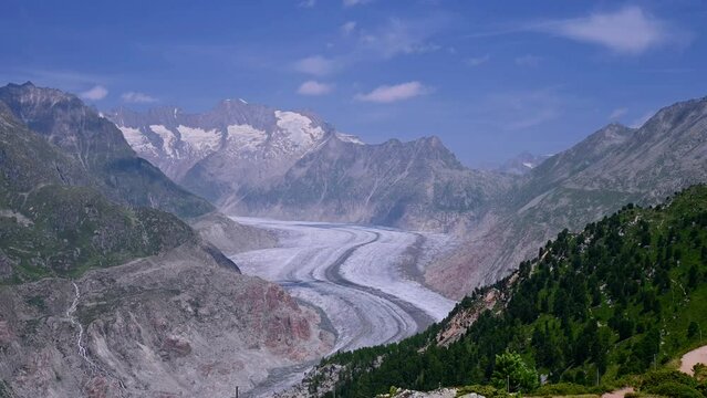 Landscape of glacier, mountain and forest. Real time of Aletsch Glacier in Swiss Alps. Riederalp, Valais Canton, Switzerland. Travel destinations. Ice melting.