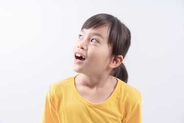 Portrait of happy excited amazed open mouth kid child girl look in copyspace isolated on white background
