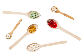 Top view Variety of vitamin and mineral pills in wooden spoon on Colored background. Top view of assorted pharmaceutical medicine pills. Dietary supplement healthcare product