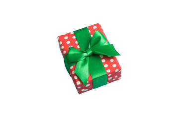 Wrapped christmas or other holiday handmade present in paper with colored ribbon. Present box, decoration of gift on table, top view with copy space