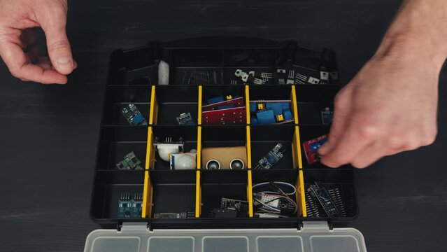 Top-View Electronics: Hands Sorting and Inspecting Electrocomponents in Organizer