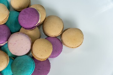 Delicious assortment of colorful macaronspresented in a white bowl