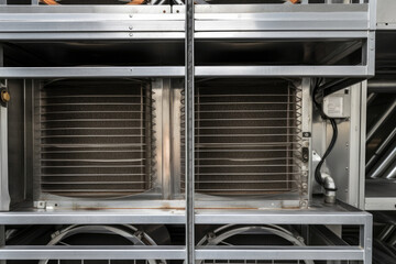 Detailed close-up of an industrial air handling unit with intricate metal components and filters visible