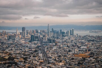 the city of san francisco, california and its mountains are in the background