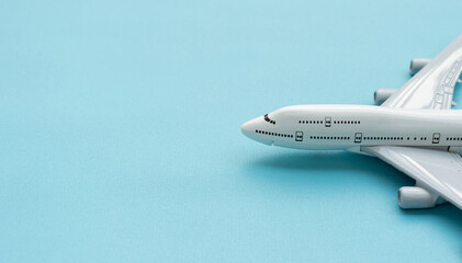 A plane miniature isolated on blue background, after some edits.