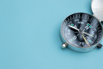A compass isolated on blue background, after some edits.