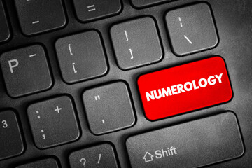 Numerology is the pseudoscientific belief in a divine or mystical relationship between a number and one or more coinciding events, text concept button on keyboard