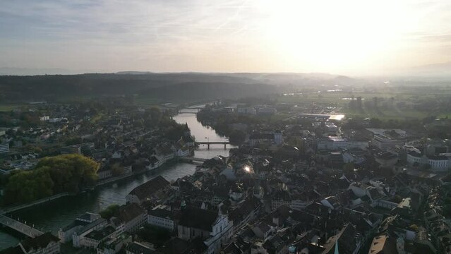 Aerial of the river passing through the beautiful solothurn town in Switzerland during the sunset