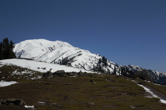 Winter landscape featuring a snowy hill: Makra Peak, Siri Paay Pakistan