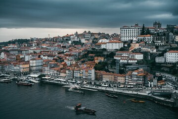 Fototapeta na wymiar Aerial view of the bustling cityscape of Porto, Portugal in the evening
