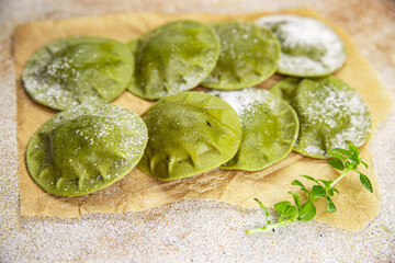 green ravioli green dough spinach, basil vegetable food healthy meal food snack on the table copy space food background rustic top view