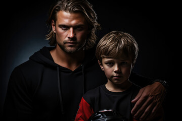 Man And Young Boy Ice Hockey Player Standsa Black Background . Ice Hockey, Man, Young Boy, Black Background, Teamwork, Equipment, Winter Sports, Safety