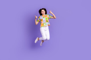 Full body photo of schoolgirl jump double thumbs up recommendation feedback rate summer camp tourist isolated on violet color background