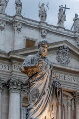 Scenic view of St Peter's Basilica in Vatican City, Rome, Italy featuring a grand statue