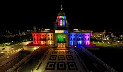 Fototapeta na wymiar Aerial view of the illuminated Providence RI State House in rainbow colors for Pride Month