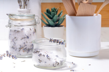 Fototapeta na wymiar Aromatic lavender salt for cooking. Sea salt mix with dried lavender flowers, trendy seasoning condiment for cooking food, grilling, drinks and cocktails
