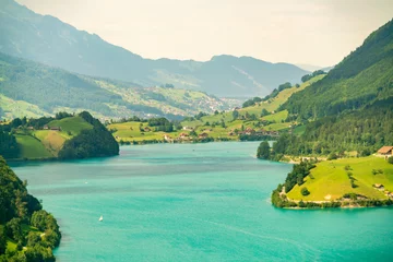Gordijnen Lake Lungern in summer with beautiful nature surrounding, switzerland © TambolyPhotodesign