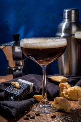 Parmesan Cheese Espresso Martini Cocktail, cheesy whipped coffee drink in martini glass with grated...