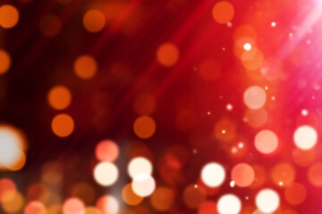 Colorful Background. Orange light leak and Glittery Defocused Lights over black background.
