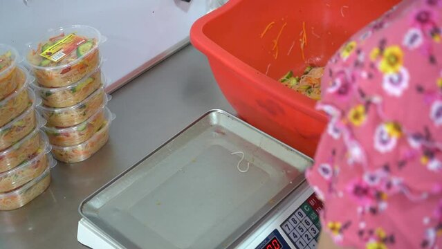 packing the noodles with a weighing machine