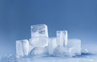 Ice cubes on blue background.