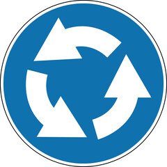 Roundabout direction sign. Mandatory sign. Round blue sign. Drive around the flowerbed (central island) in the direction shown by the arrows at the roundabout. Road sign.