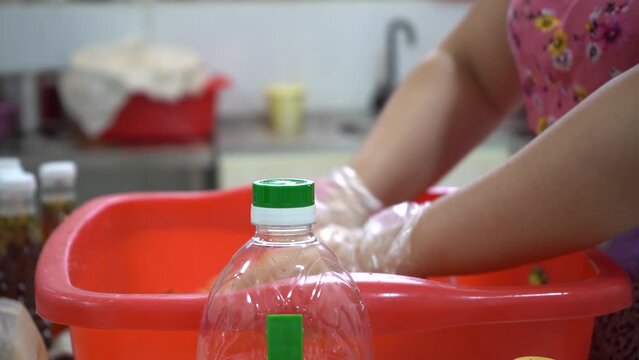 a woman mixing rice noodles in a korean restaurant
