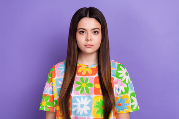 Photo portrait of attractive teen woman look serious camera dressed stylish flower print clothes isolated on purple color background