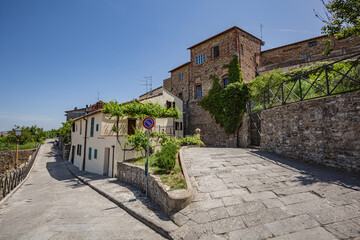 Lucignano, Italy - 23 of May 2022: Walking streets of small historic town Lucignano.