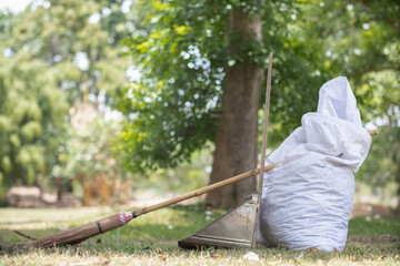 White sacks are used to contain dead leaves that have fallen seasonally in spring as way to clean...