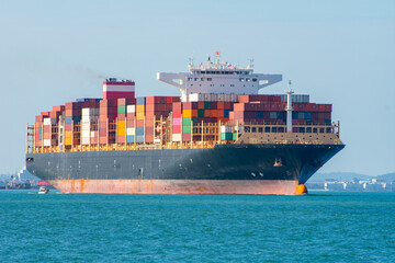 Top view Container ship full capacity approaching  port International Container ship loading, unloading , Freight Transportation, Shipping,Logistics, import export, . Global transport business.