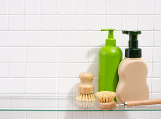 Eco friendly dish brushes and dirty dishwashing gels. Copy space for text.