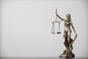 statue of god Themis Lady Justice is used as symbol of justice within law firm to demonstrate...