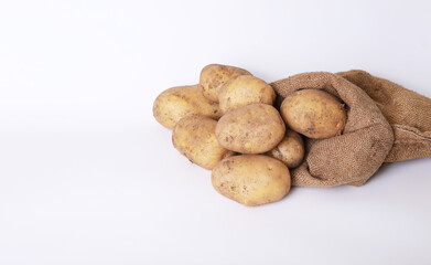 Fototapeta na wymiar Raw potatoes on a white background 